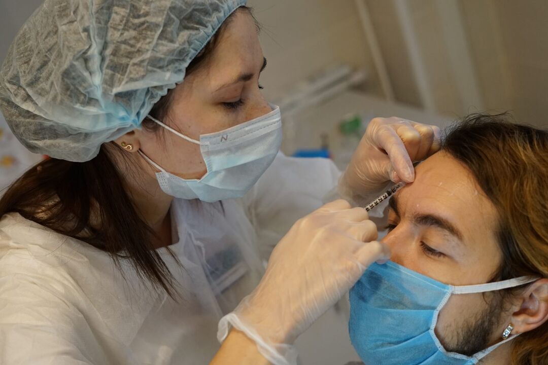 Botulinum therapy - injection procedure to rejuvenate the skin of the face